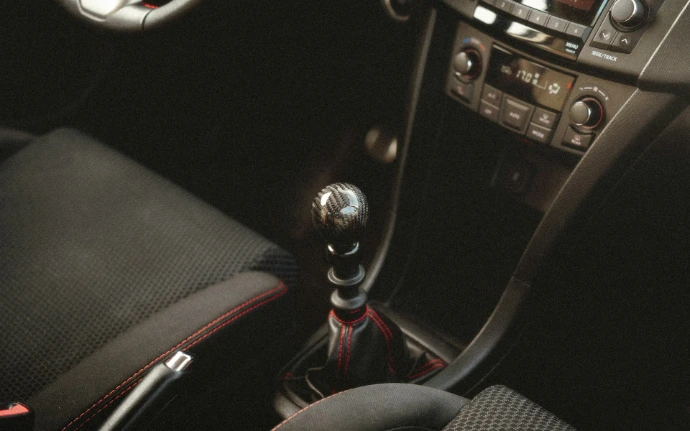 a close up of a car's steering wheel and dashboard